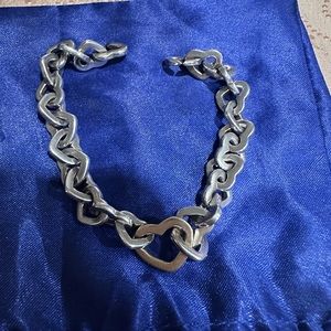 Tiffany & Co sterling silver heartlink bracelet with 18k gold heart in center.